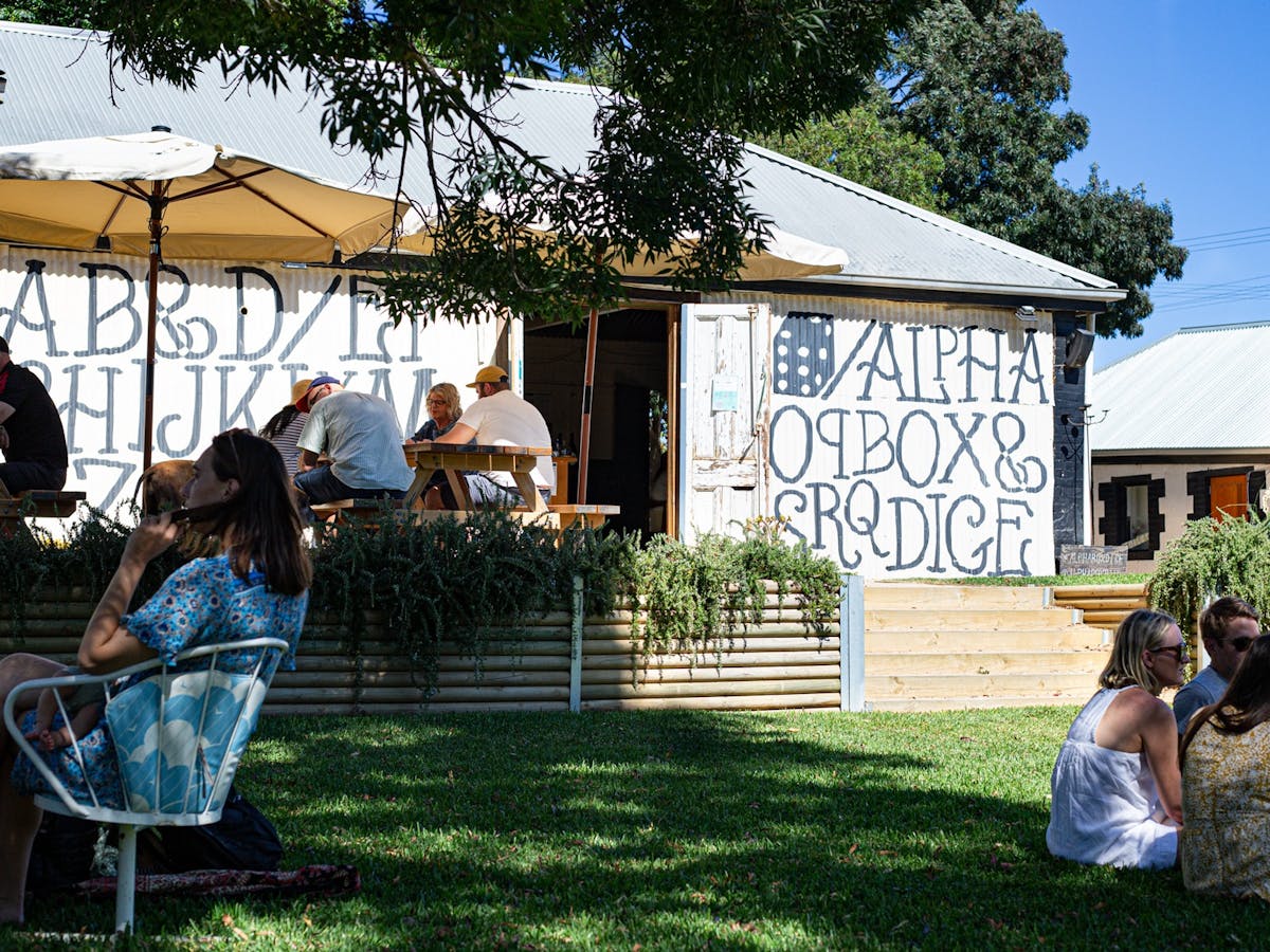 Shade yourself under an umbrella, cool down with a refreshing glass of wine.