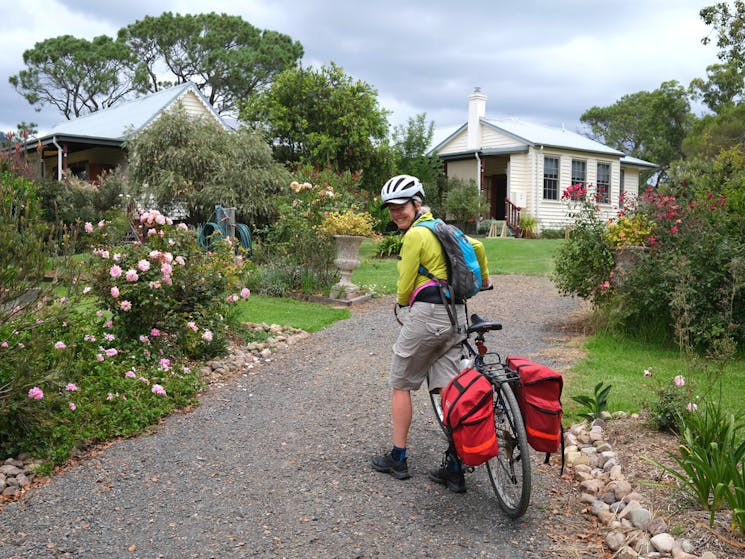 Cyclist arriving into the accommodation in South Wolumla.