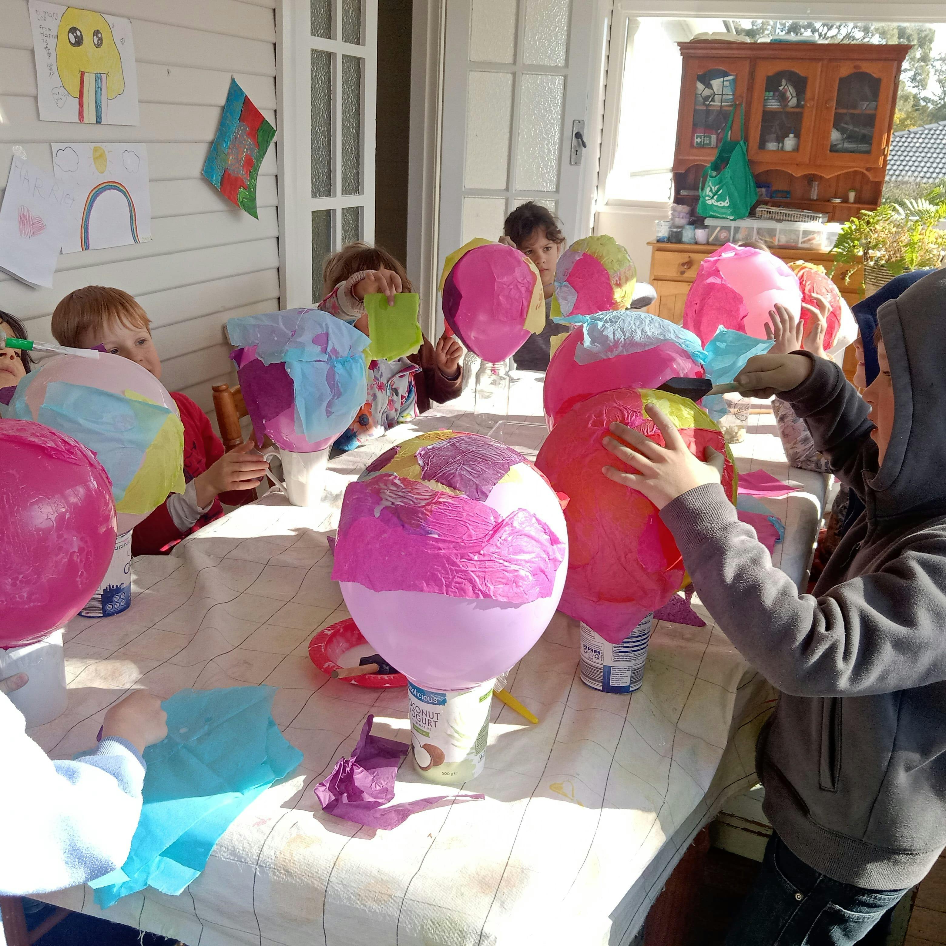 Tissue paper bowls made with a balloon