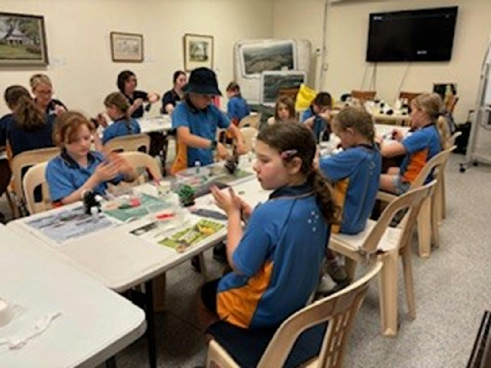 A group of children sitting at a table.