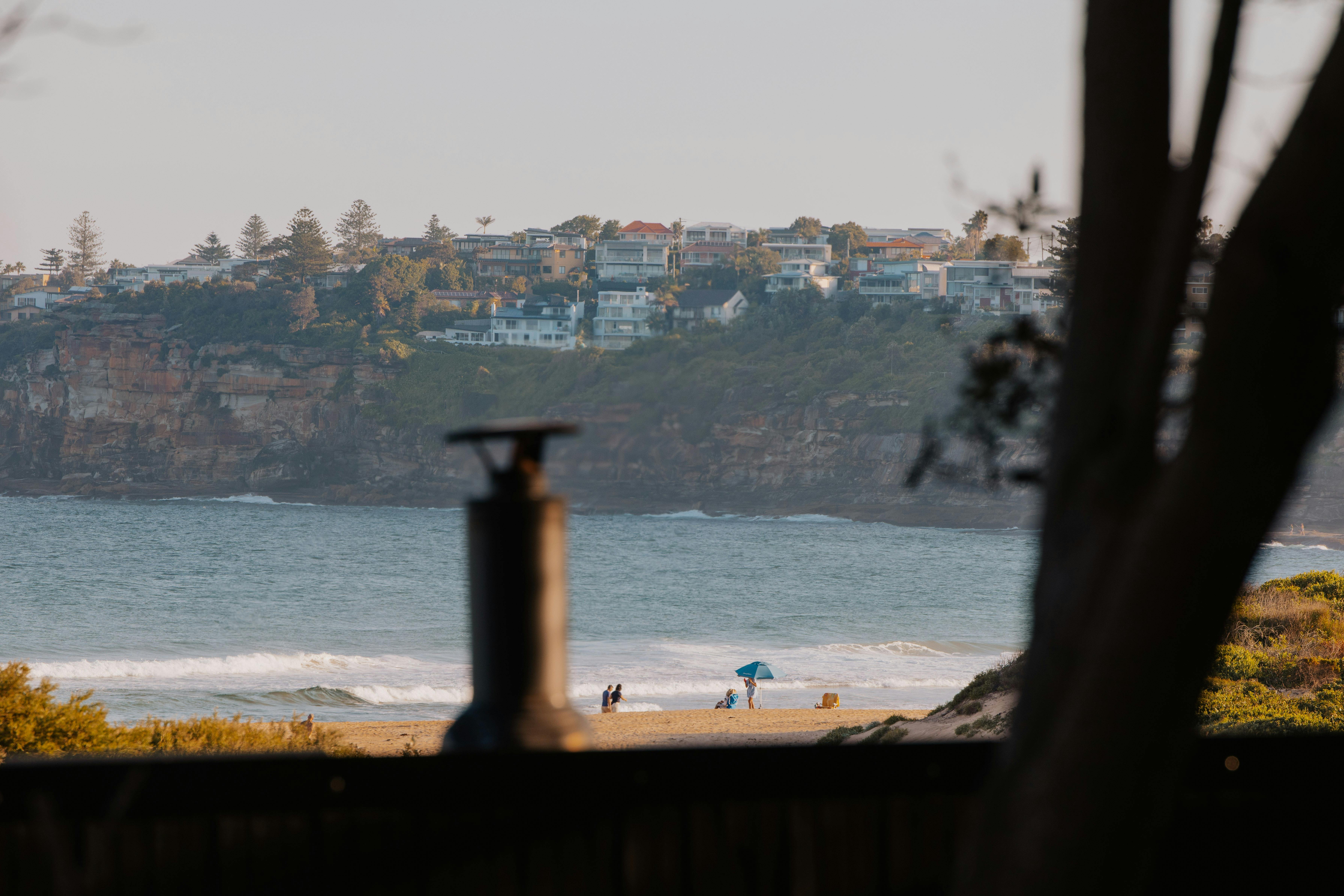 Cedar and Salt mobile outdoor sauna at long reef beach with view of the surf