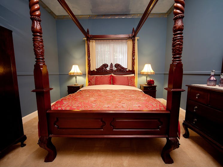 Double Four Poster second bedroom with fine linen and plush carpet