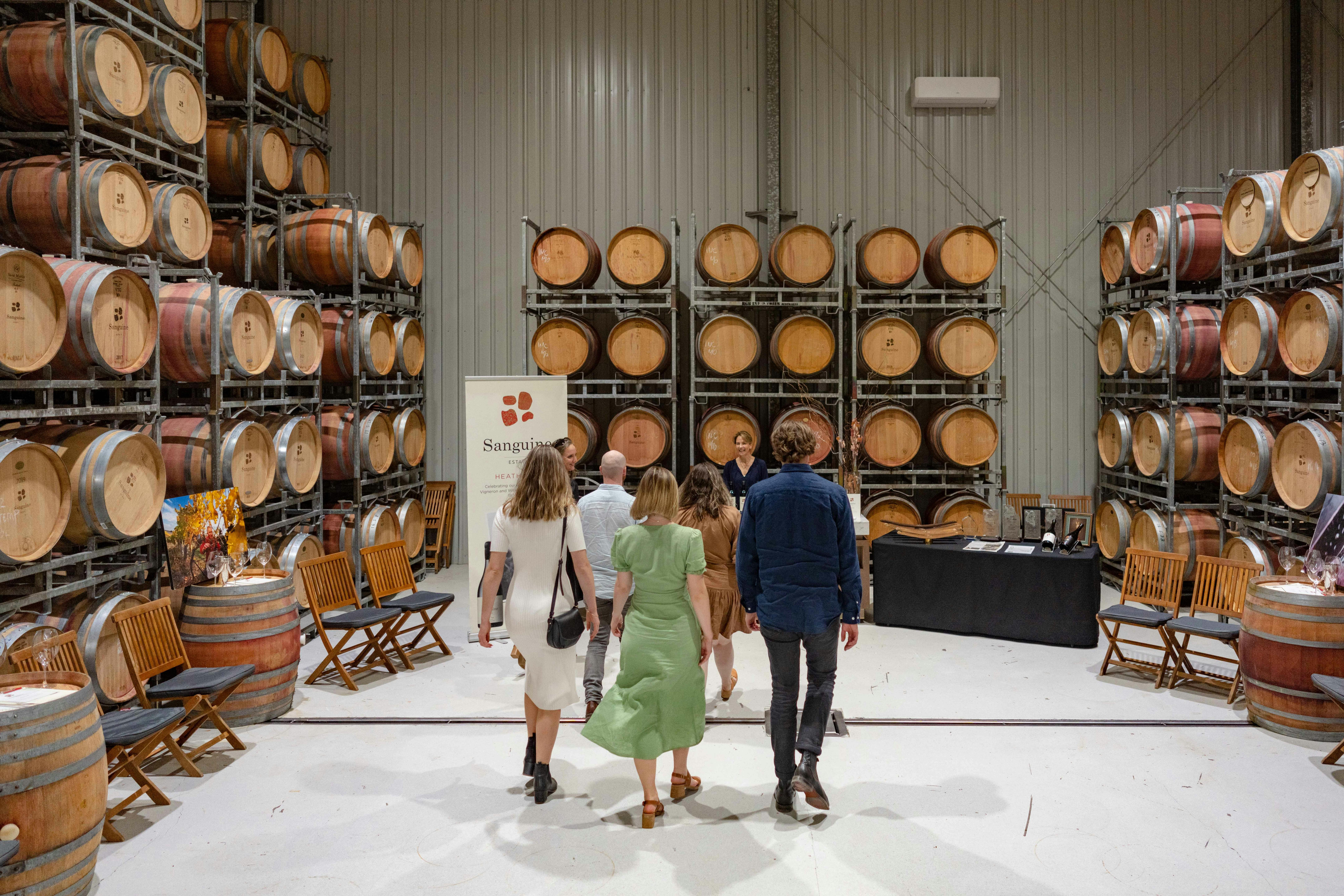 Rambling tour group entering the barrel room to taste some award winning wine
