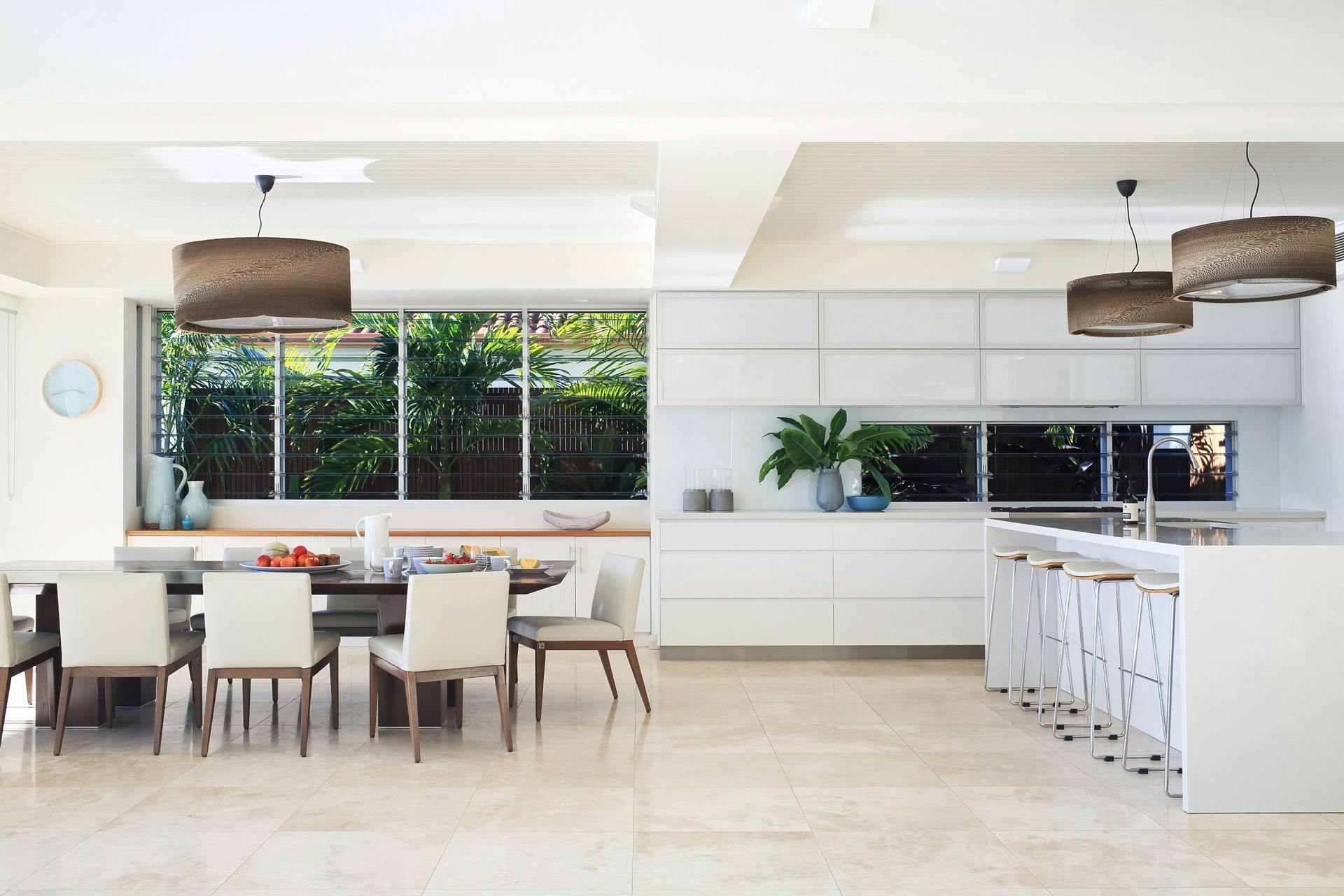 Spacious gourmet kitchen with a 3-meter long cream stone bench top, overlooking the waterfront