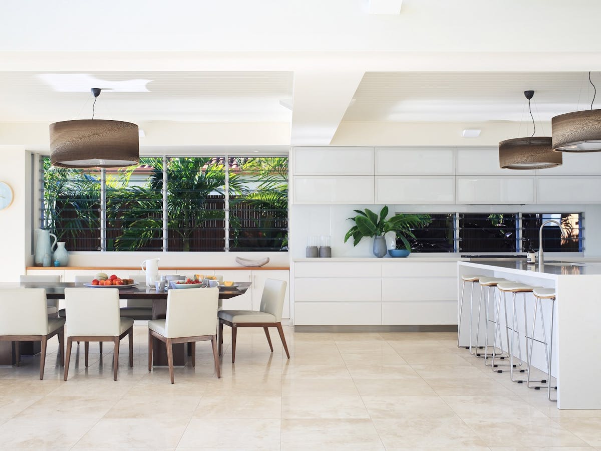Spacious gourmet kitchen with a 3-meter long cream stone bench top, overlooking the waterfront