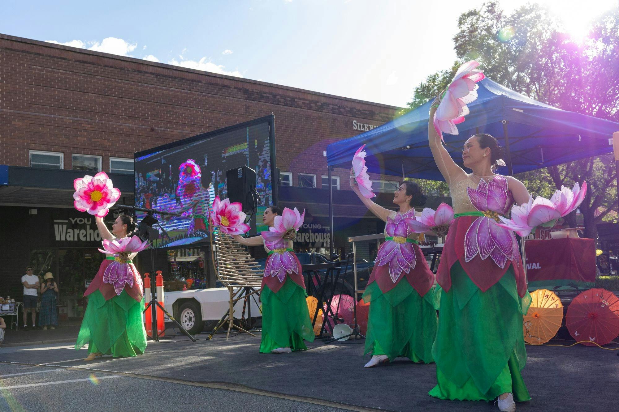 Pink Lotus Dance Vietnamese Group performing at the main stage.
