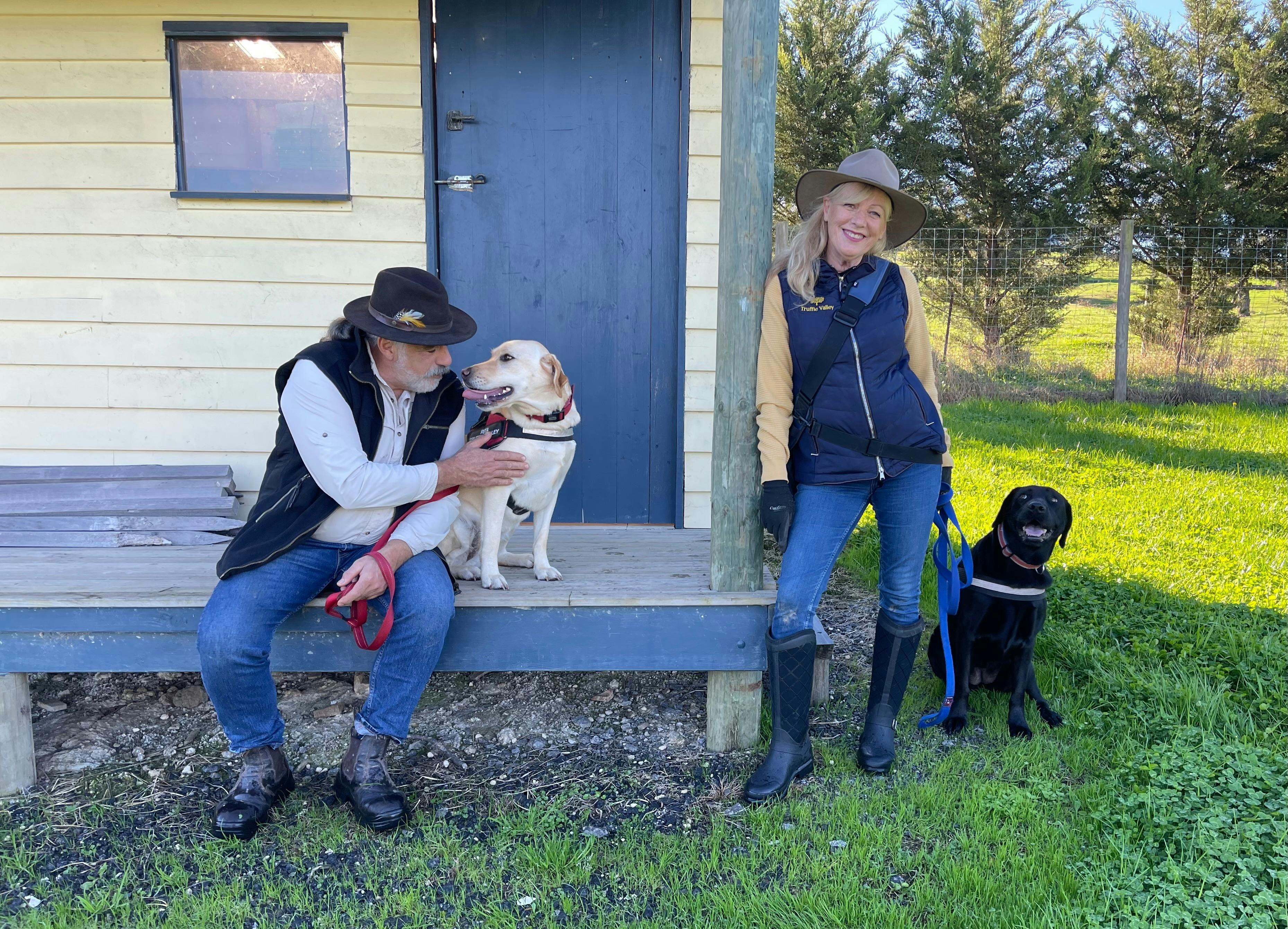 Truffle Valley owners with their truffle dogs at the truffle hut in the orchard