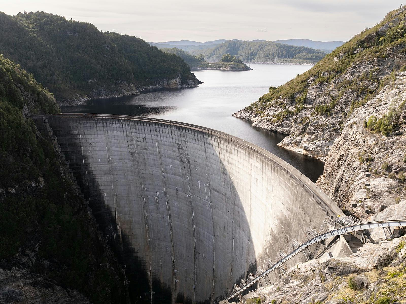 aerial shot of a dam wall holding back water