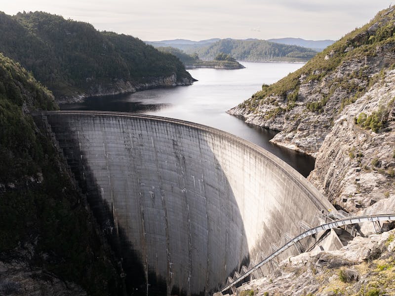 aerial shot of a dam wall holding back water