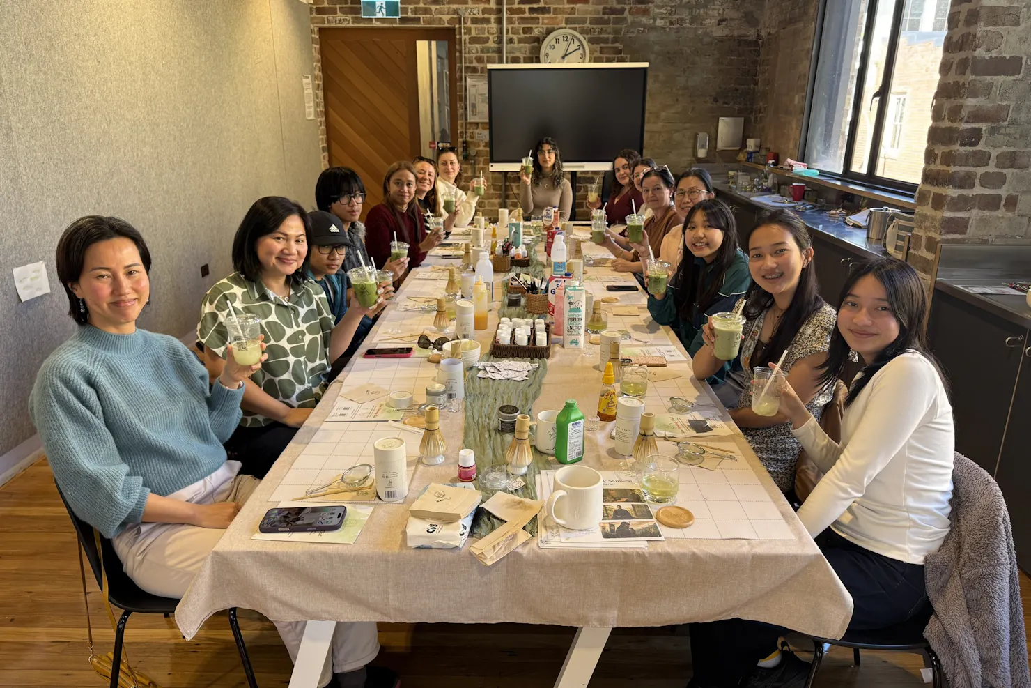 Guests painting ceramics and whisking Japanese matcha at a NOA Matcha workshop
