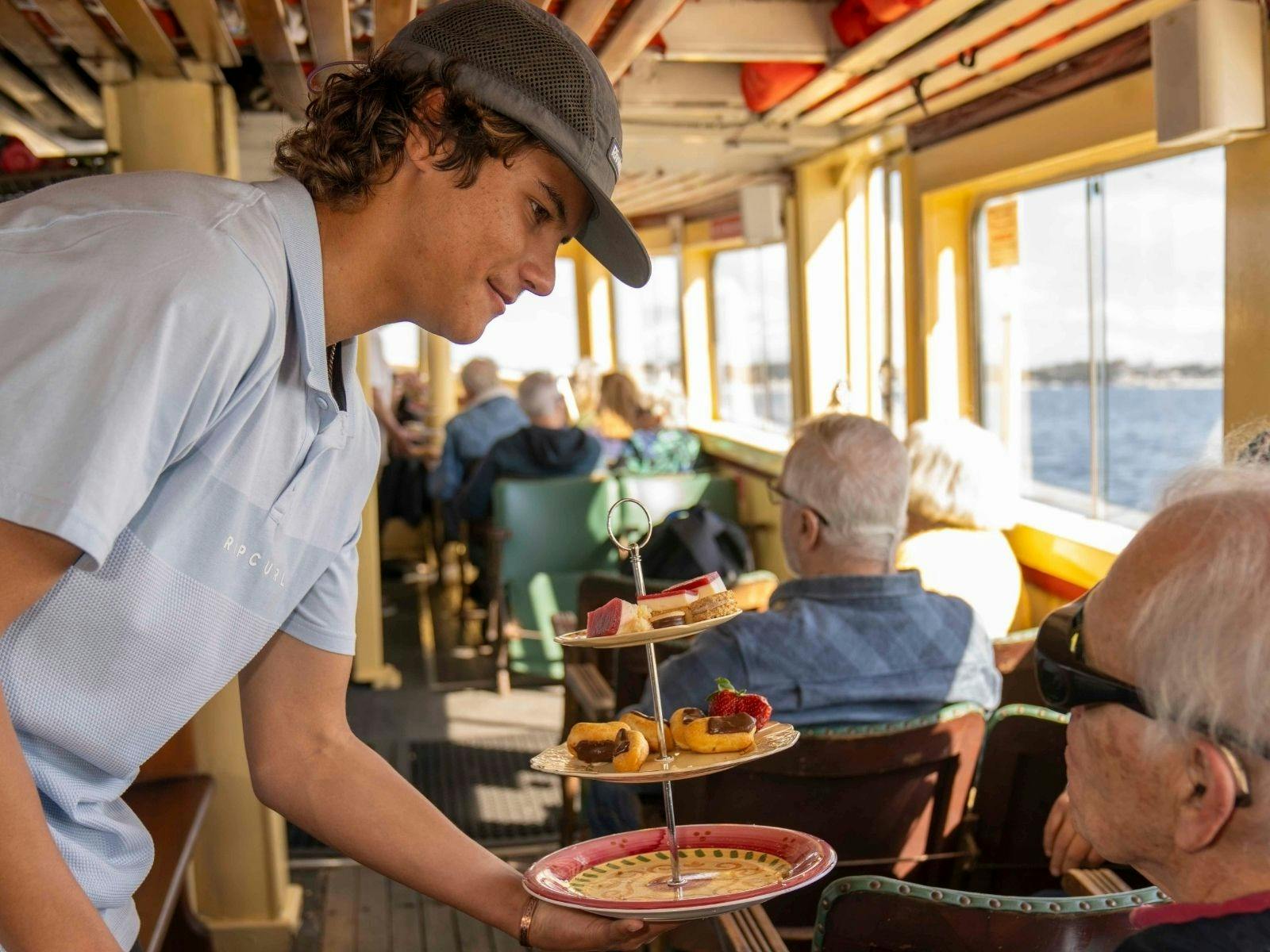 Elijah taking care of our guests on a Stinker Clarke History Cruise.