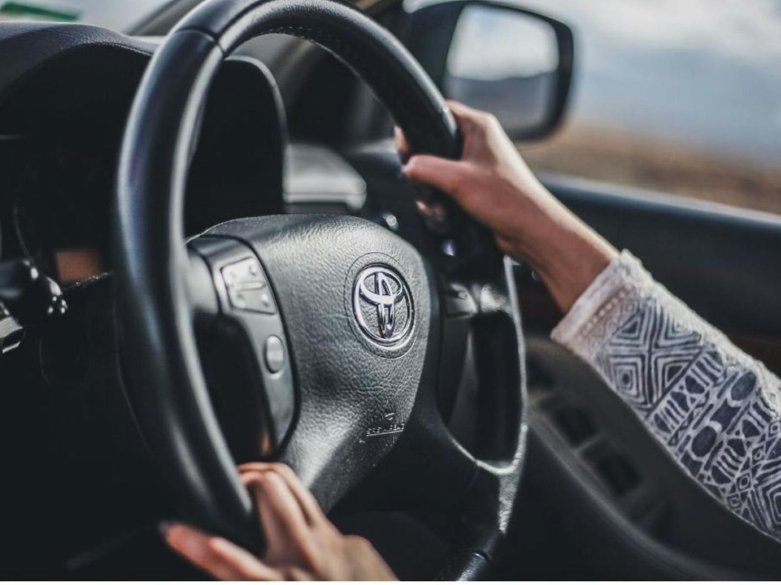 hands on a steering wheel