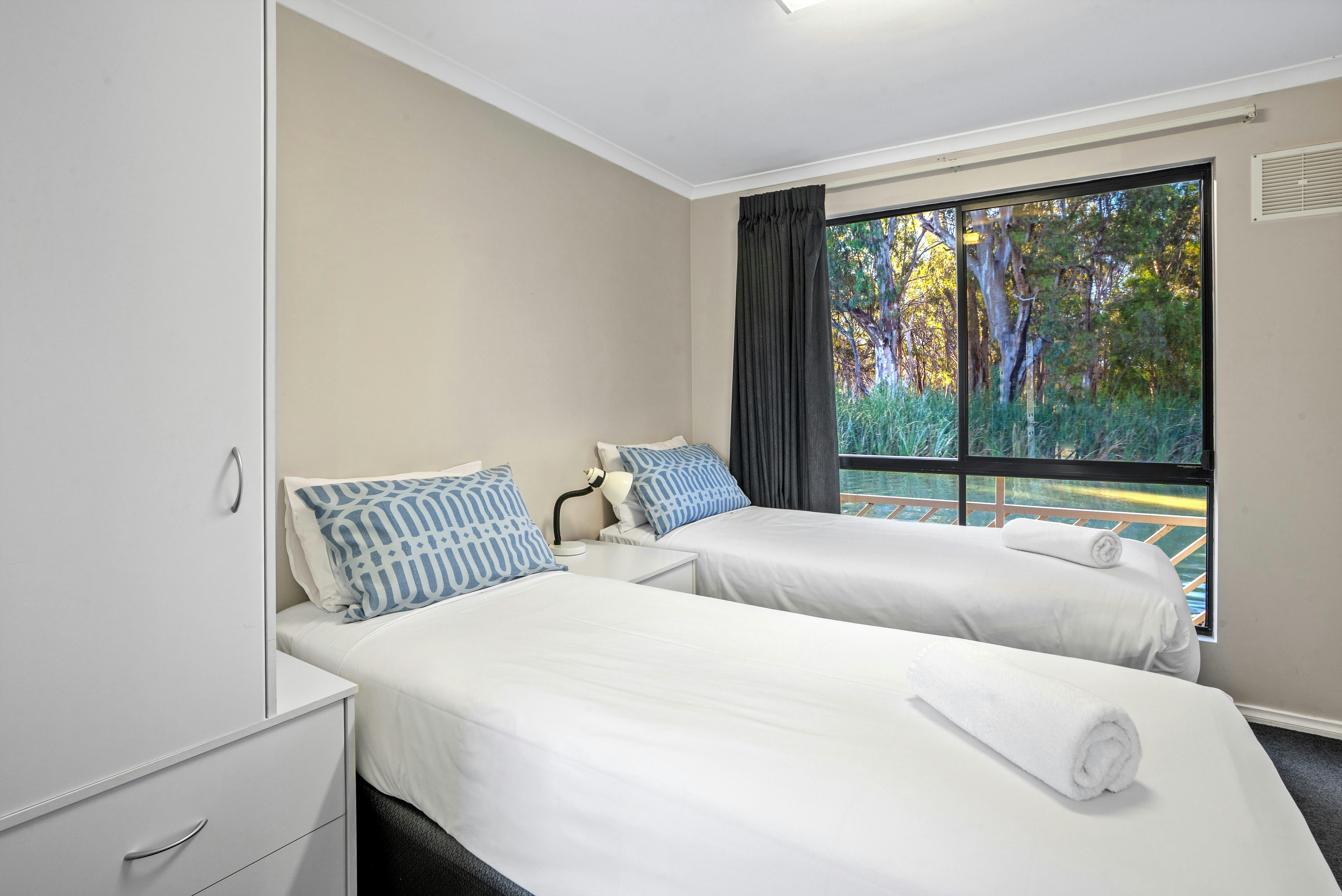 Queen bedroom split into singles