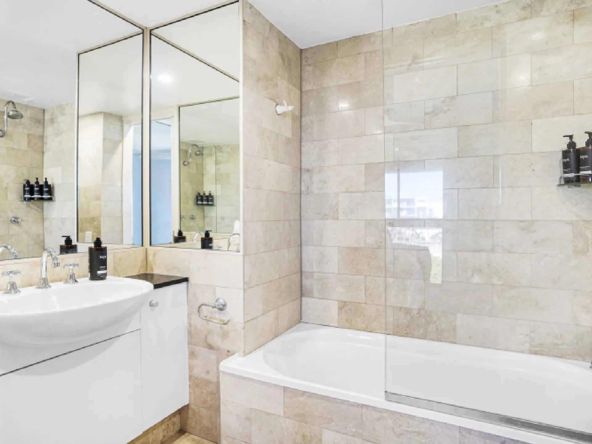 Ensuite bathroom with bathtub and shower