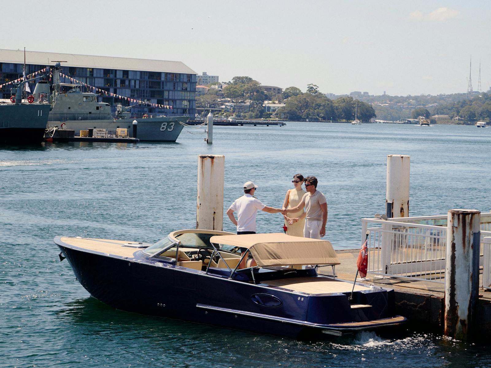 Private boat tour on MV Aquamajestic cruising Sydney Harbour with city skyline views.