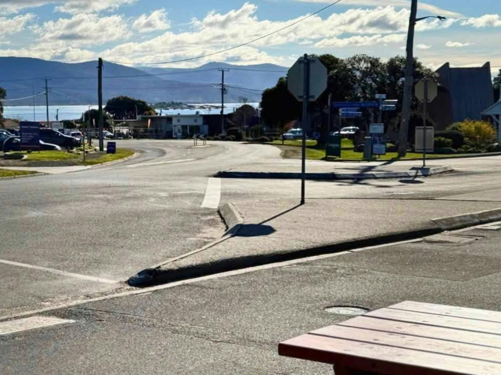 A view looking down the main street of Bicheno towards Waubs Beach with glimpses of Diamond Island