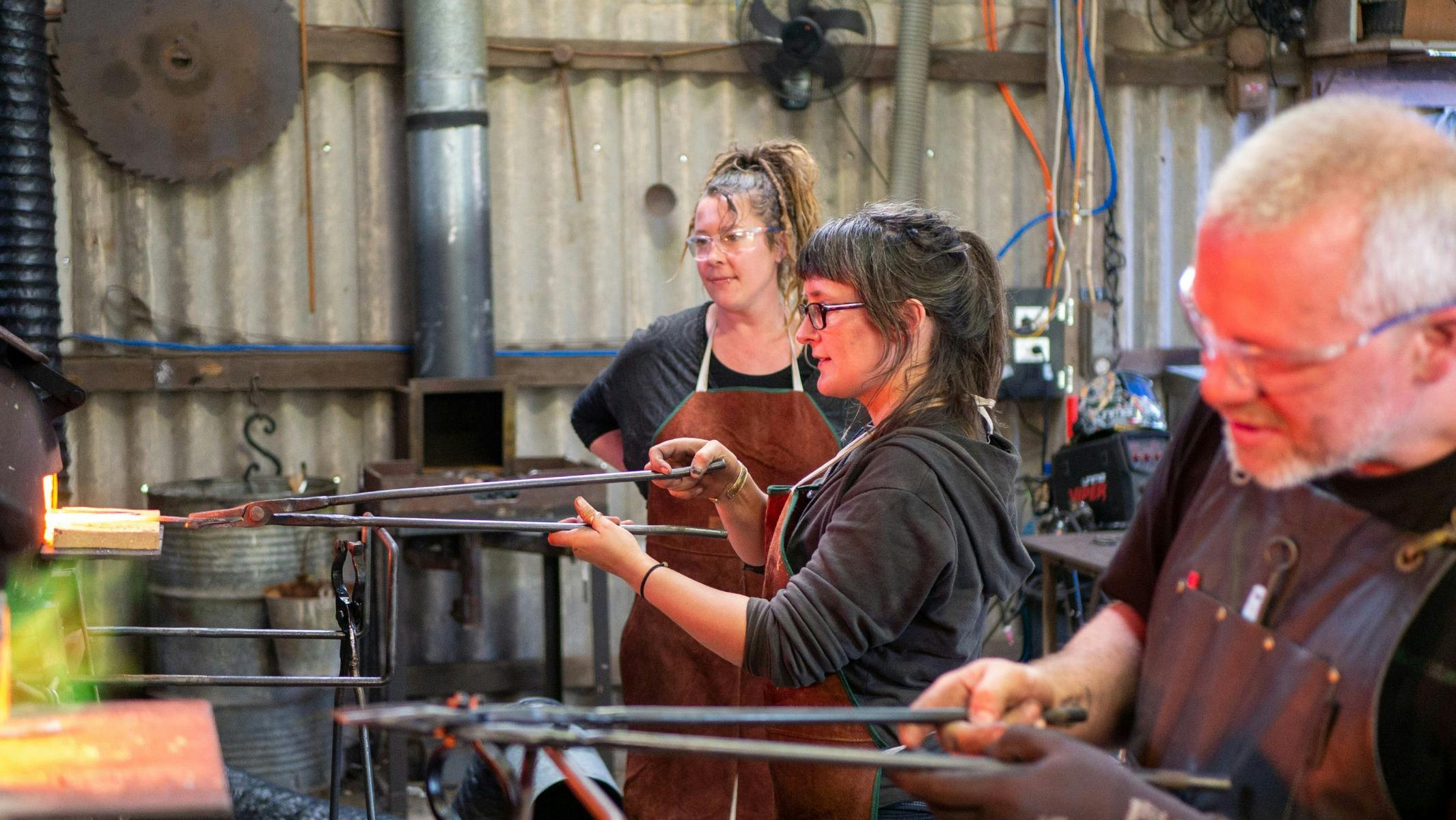 People blacksmithing