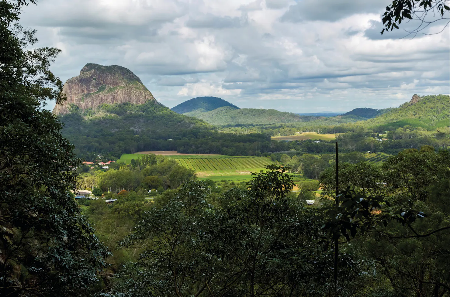 farmland with mountains rising in background.