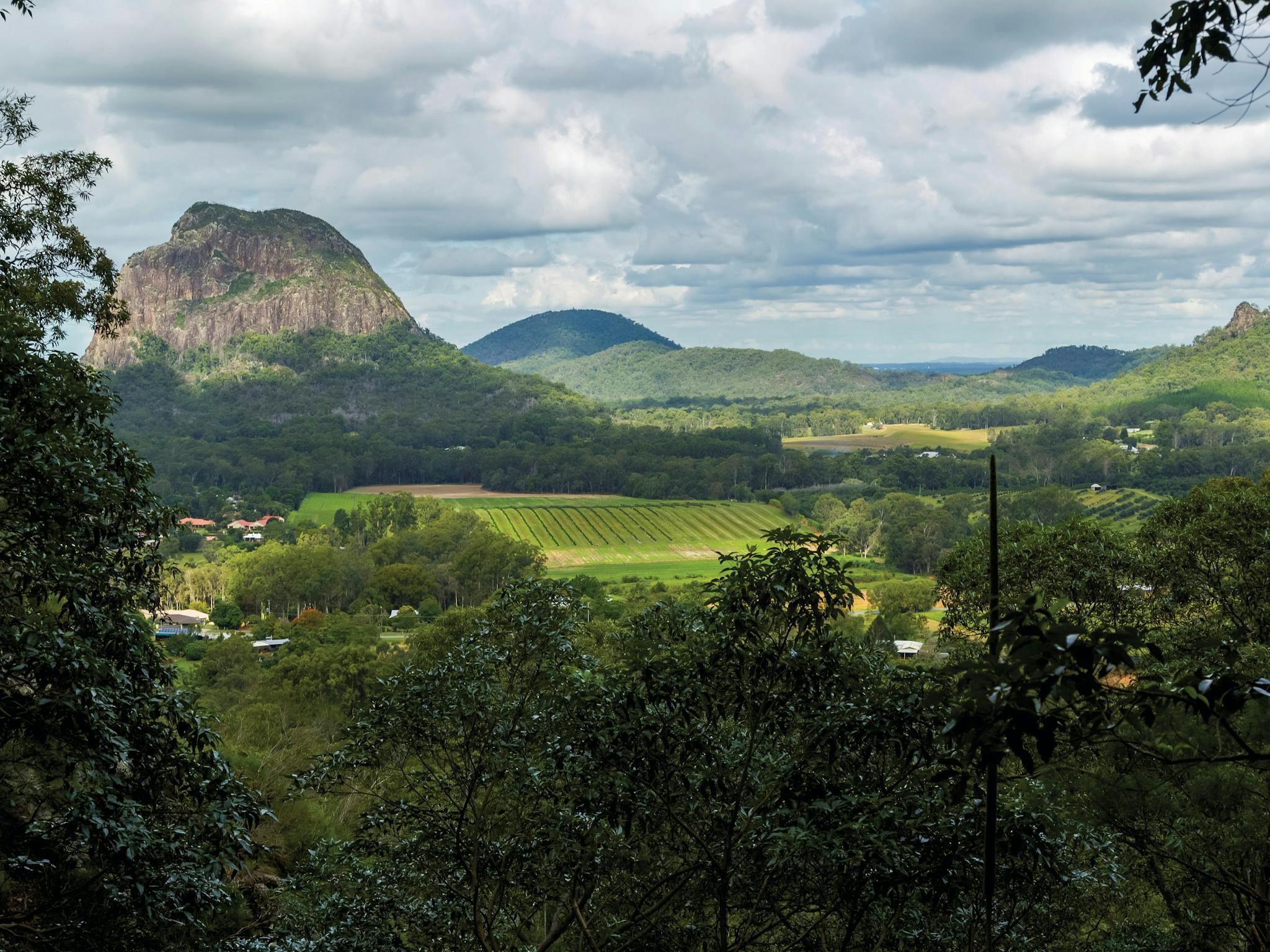 farmland with mountains rising in background.