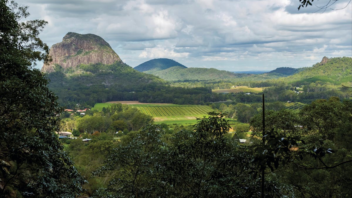 farmland with mountains rising in background.