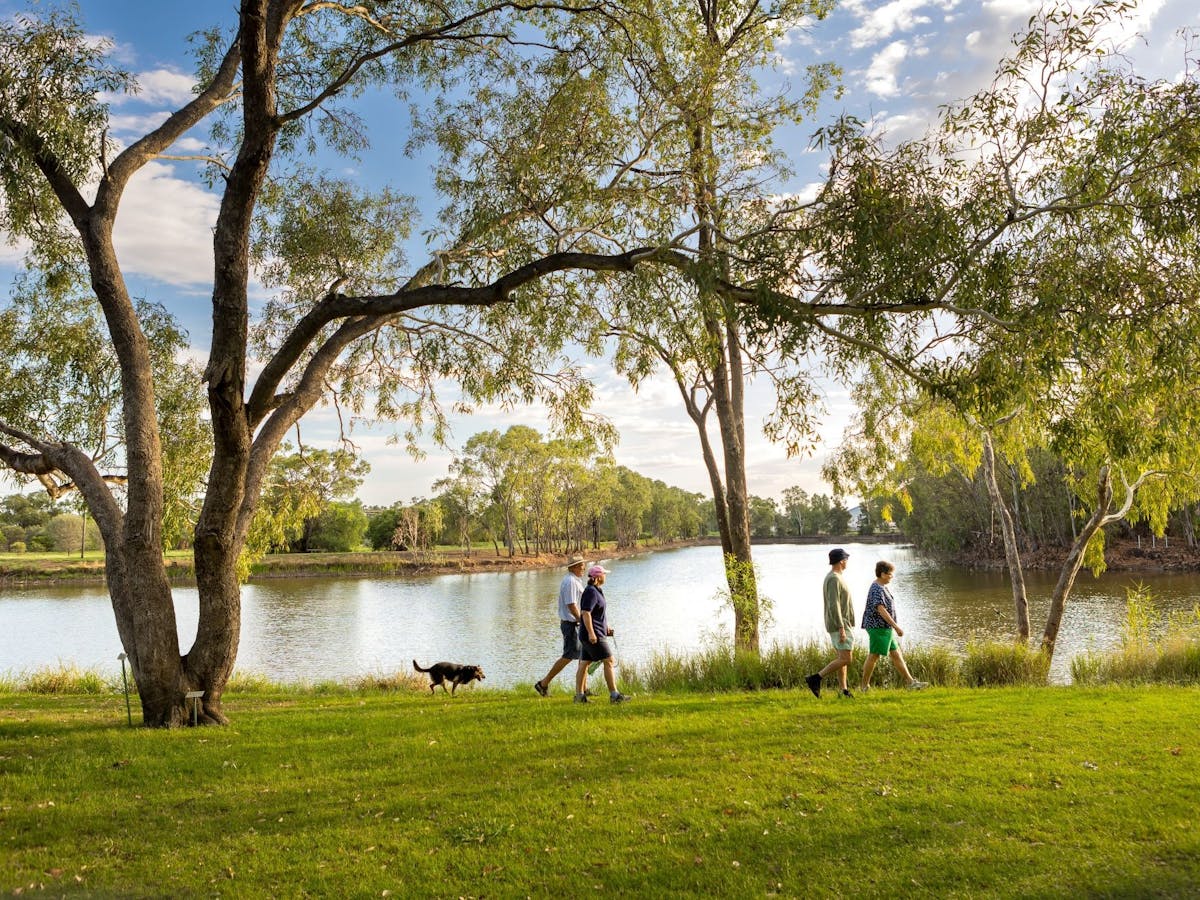 People walking by the lagoon at the Botanic Gardens