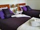 Heavenly single beds in twin share bed room