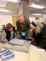 Two women look at the archives at Charles Sturt University