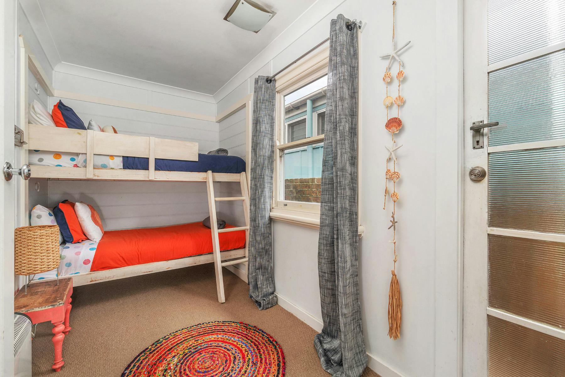 Colourful bunk beds with night time reading lights