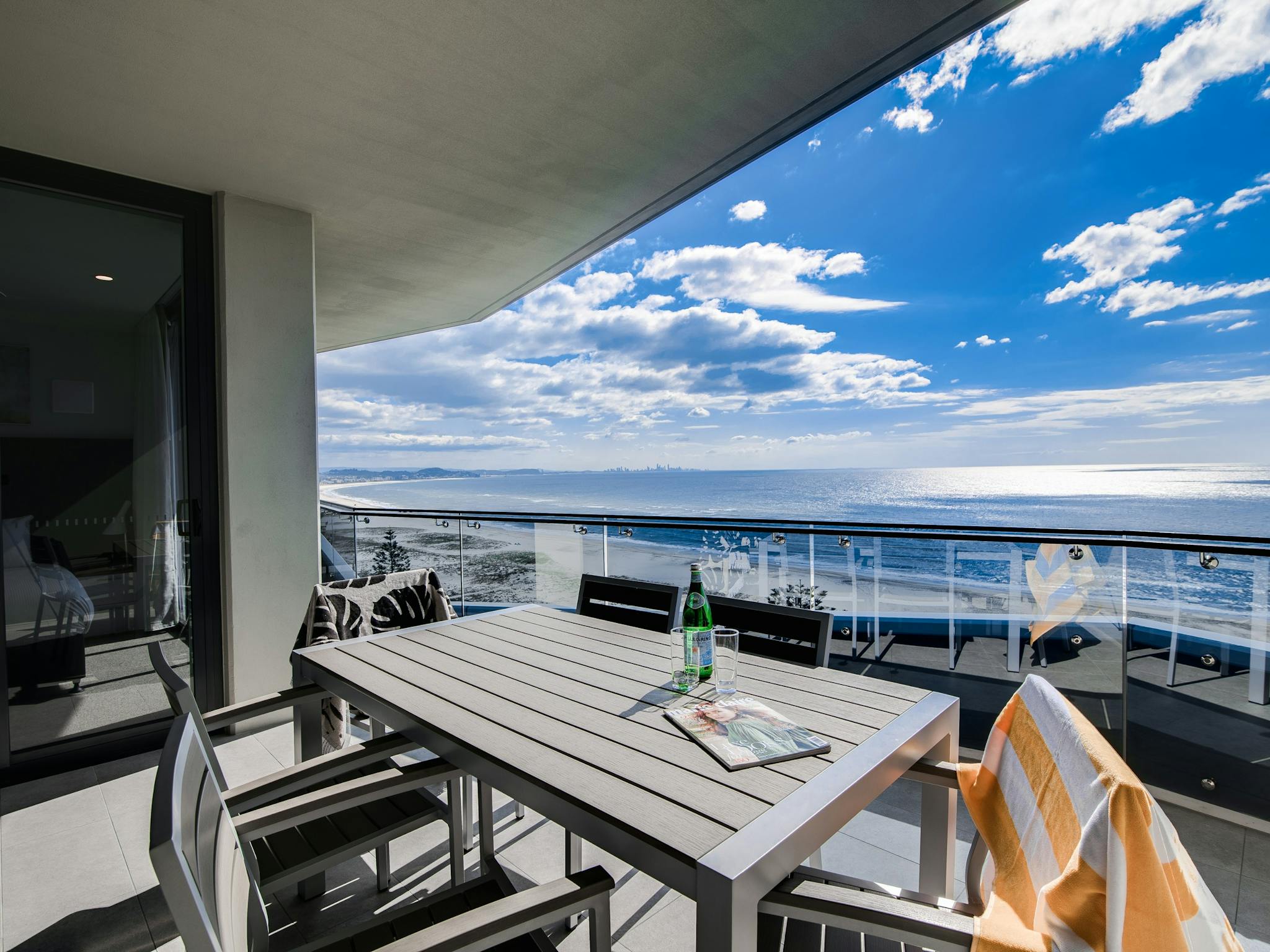 Ocean & beach views from the balcony of the ocean front apartment. Outdoor seating for meals. Ocean & beach views from the balcony of the ocean front apartment. Outdoor seating for meals.