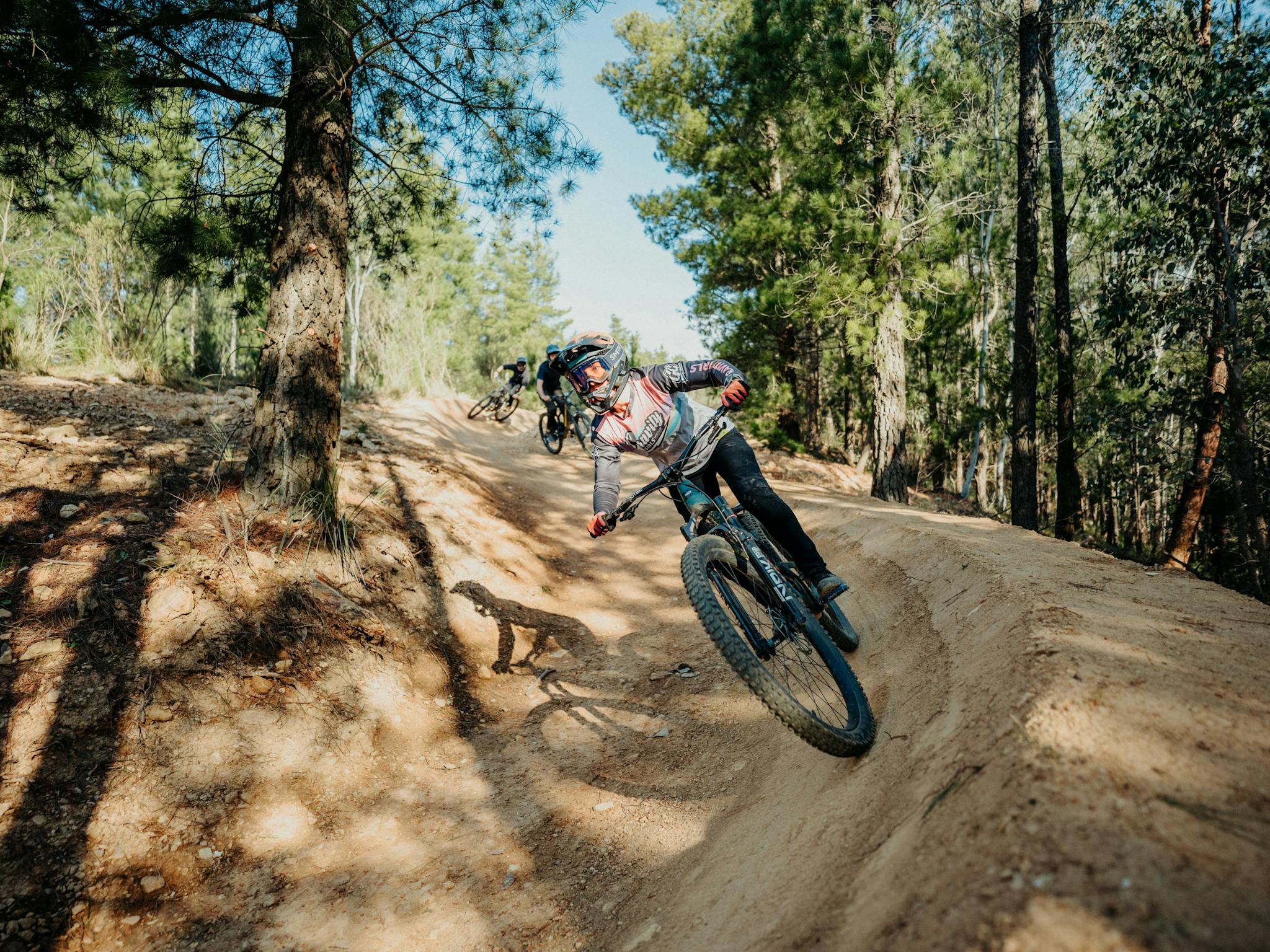 Riders enjoying Hero Trail, an intermediate jump trail