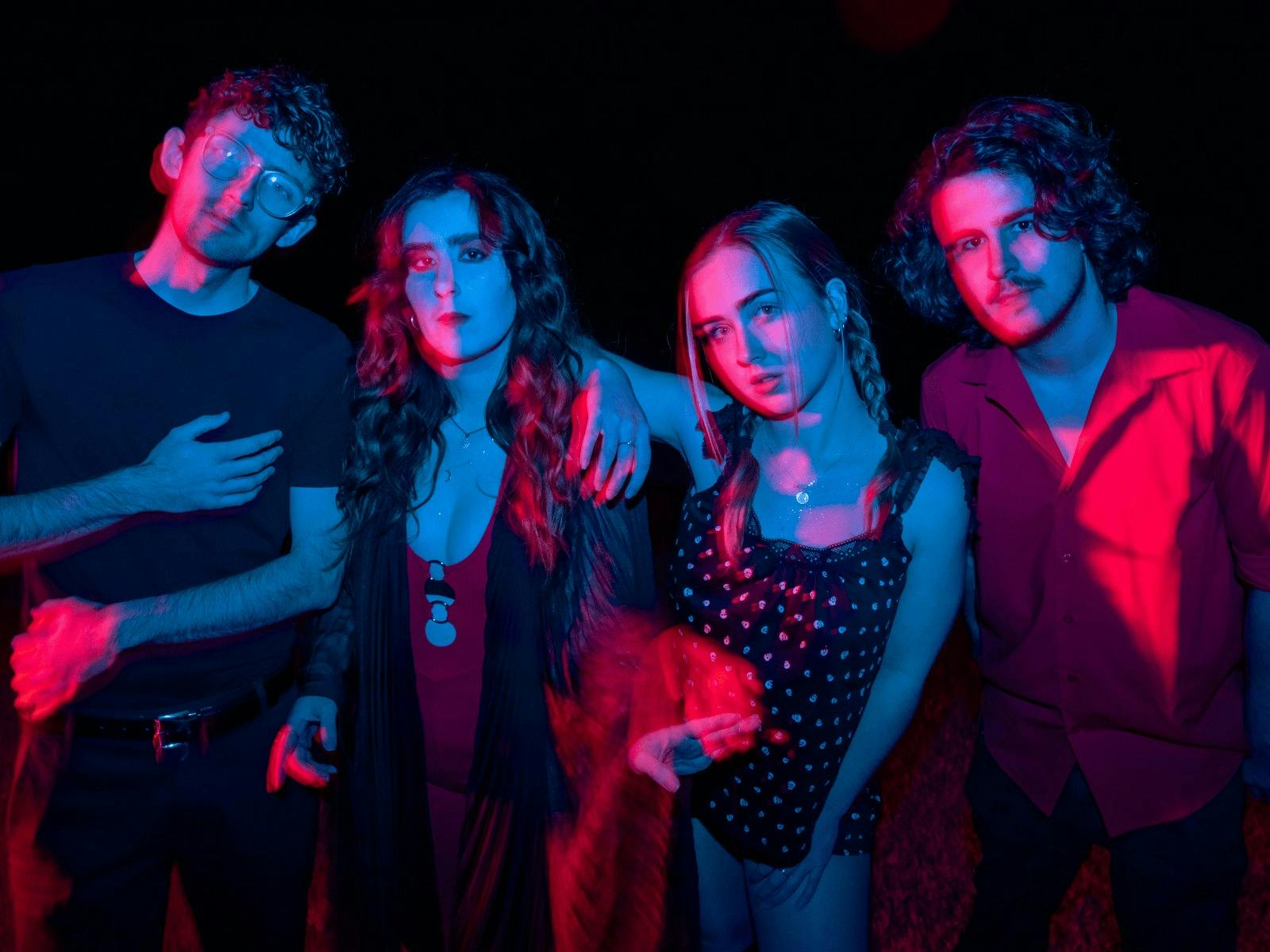 image of little quirks indie band with red and blue lighting