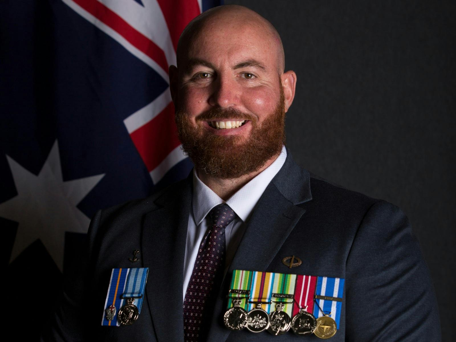 Veteran wearing a suit and medals