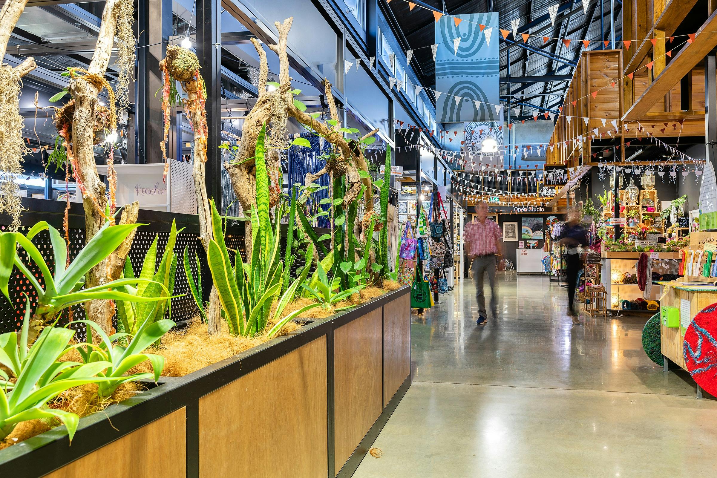 A shopper walks through Artisan Alley