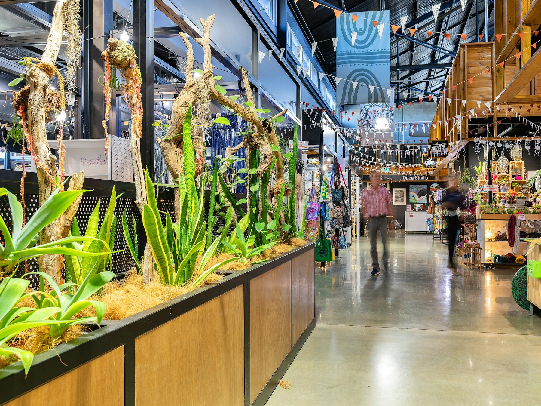 A shopper walks through Artisan Alley