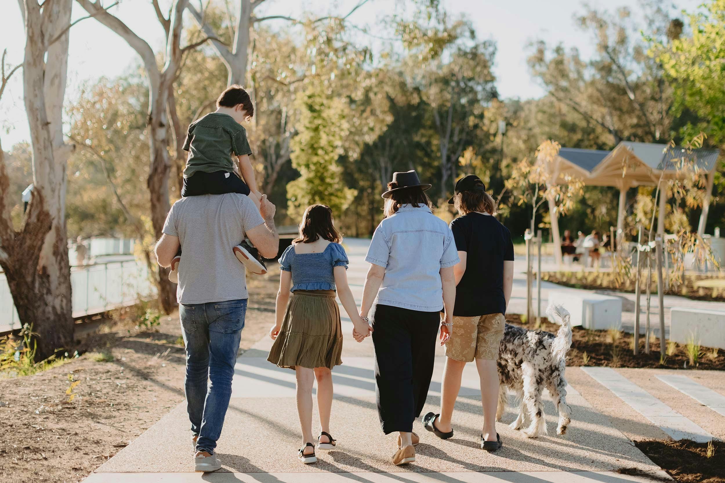 Family walking towards shade at Albury Riverside Precinct
