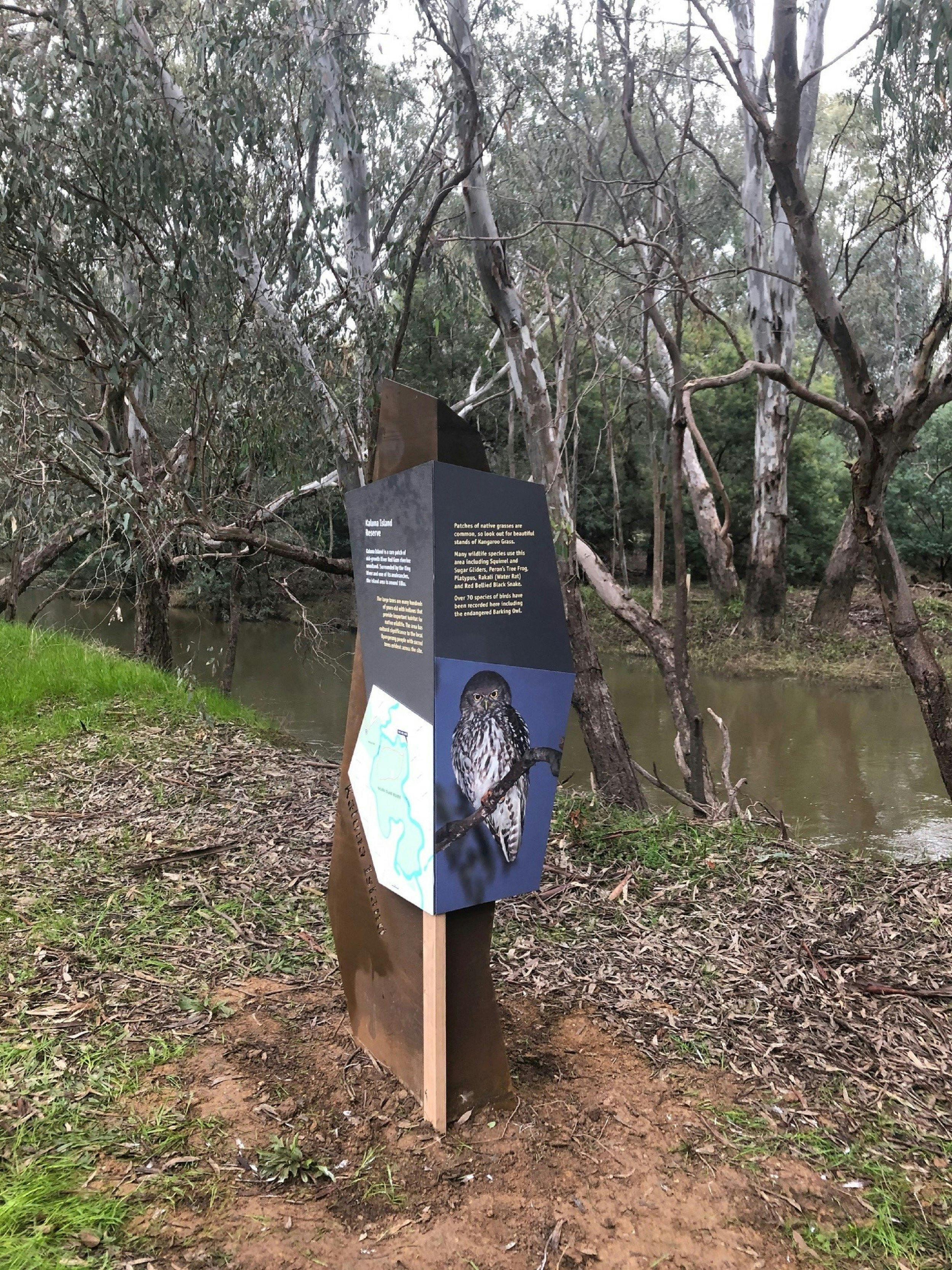 Interpretative Sign, writing, map, picture of owl, river, bush and trees in background