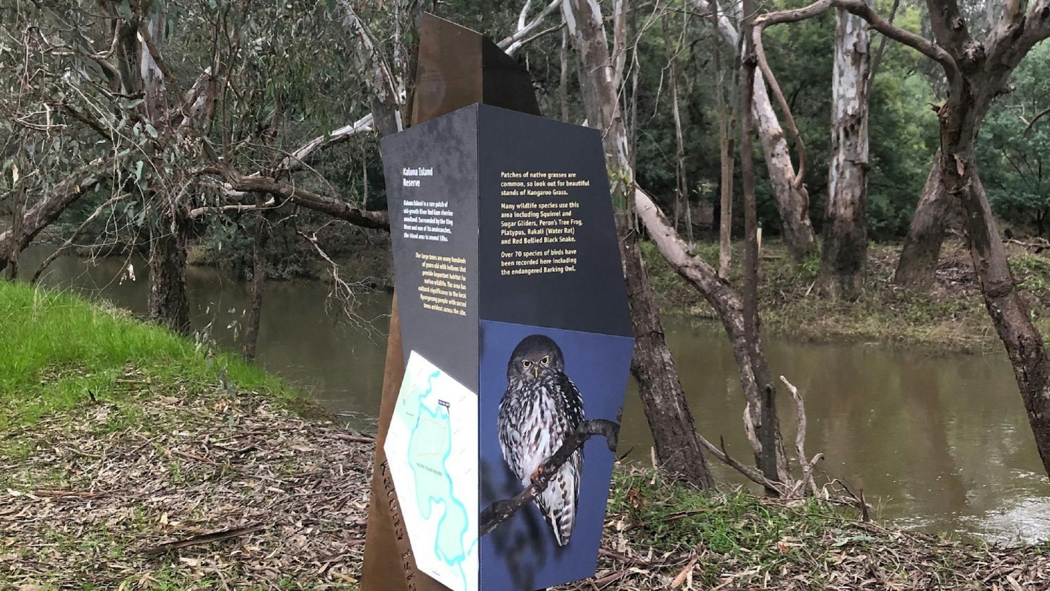 Interpretative Sign, writing, map, picture of owl, river, bush and trees in background