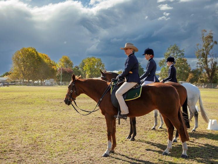 Three riders sitting on horses waiting to take part in Scone Horse Show