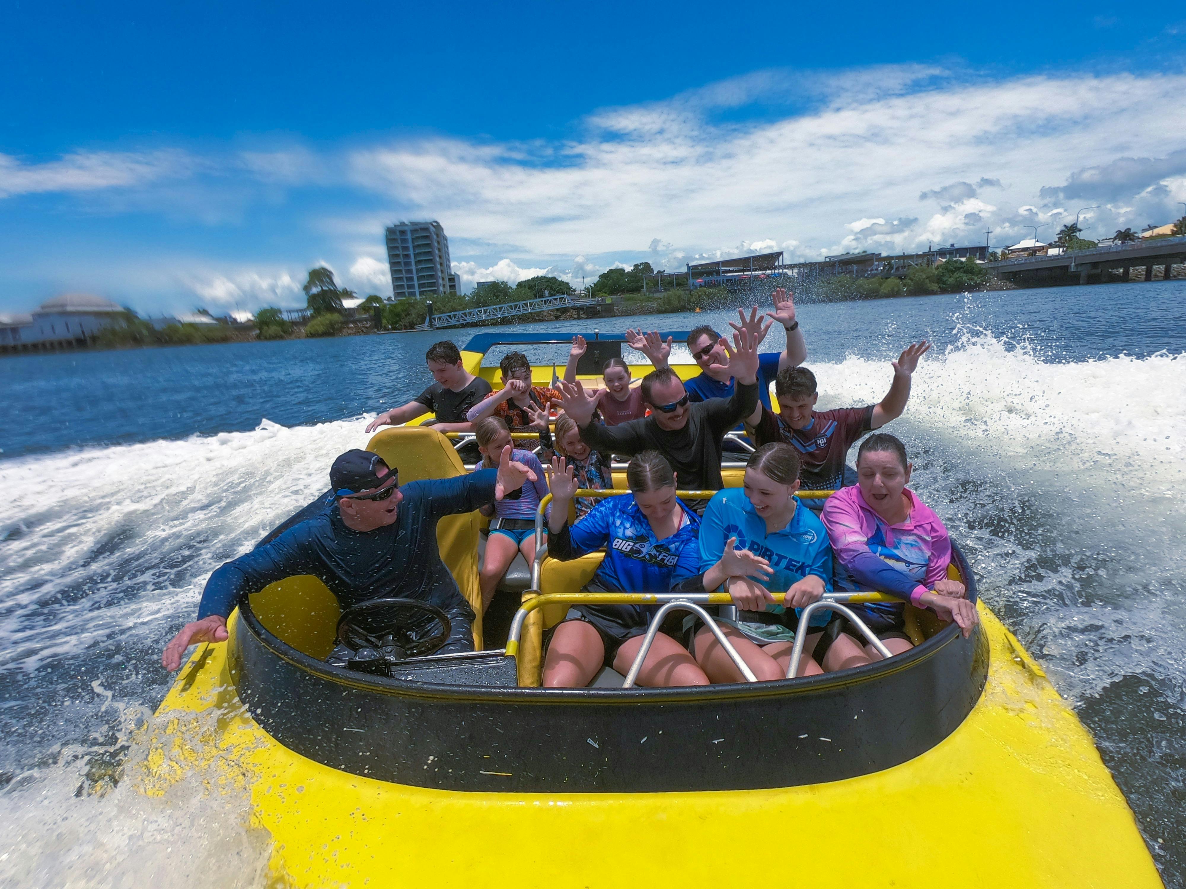 Passengers enjoying jet boat ride