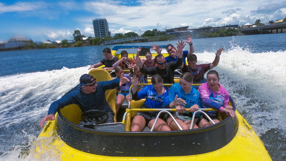 Passengers enjoying jet boat ride