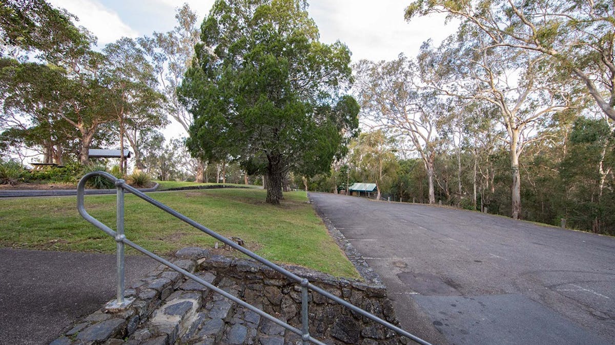 Concrete stairs and car park beside grassed area