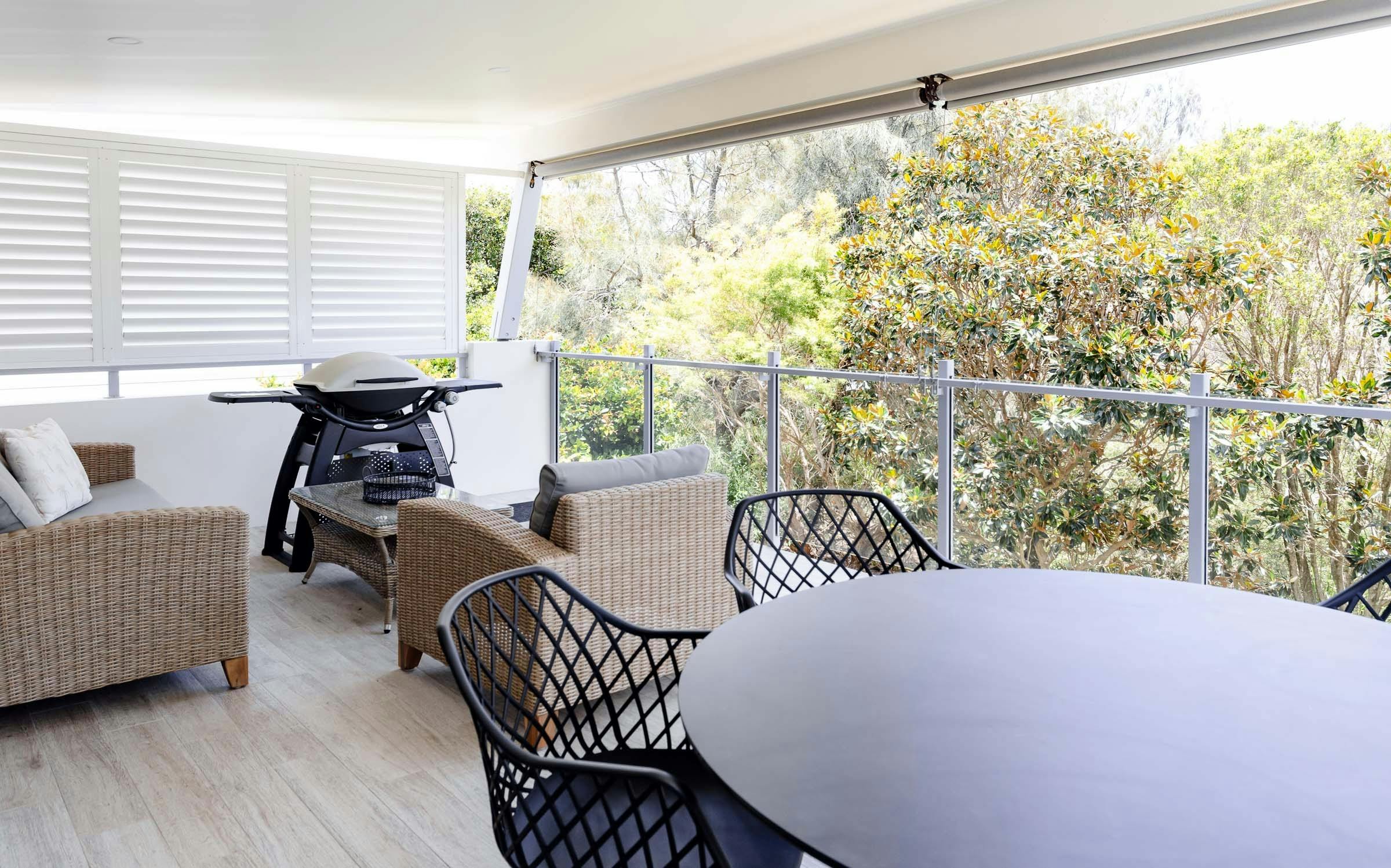Upstairs outdoor entertaining area overlooking the pool