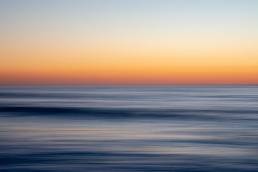 An abstract image of the ocean at sunrise