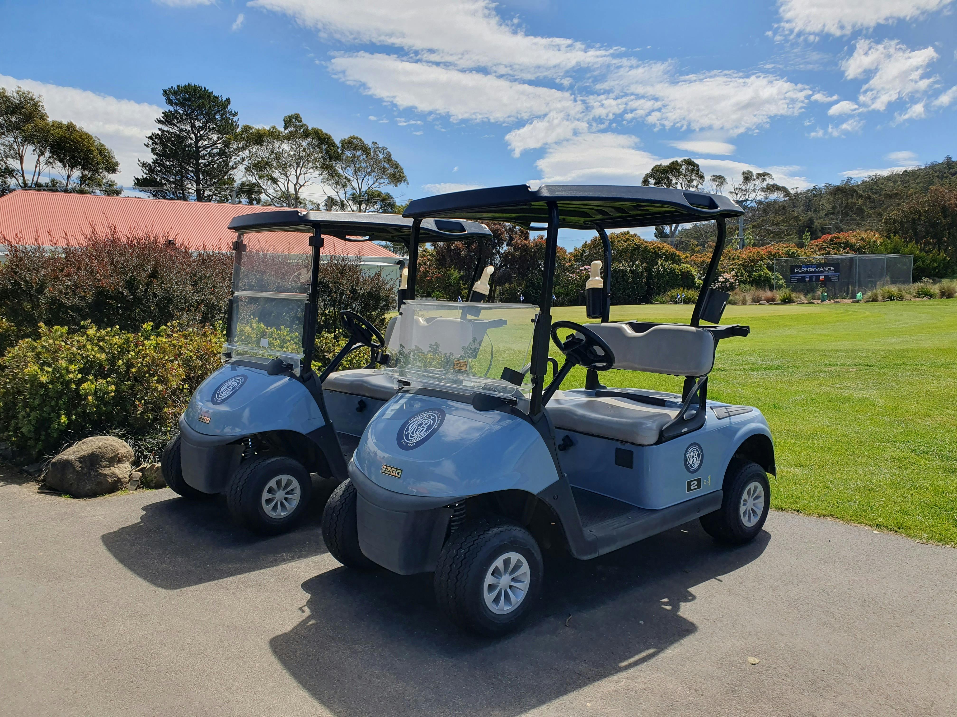 Pair of motorised golf buggies at Kingston Beach Golf Club