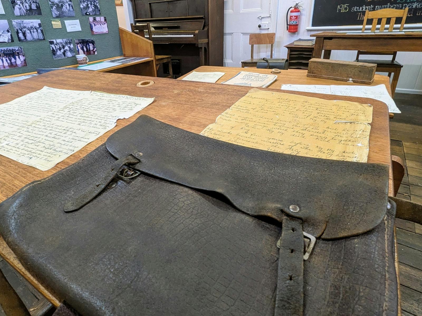 A satchel on an old fashioned desk in a classroom at the Derby Schoolhouse Museum