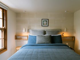 Queen bed, linen duvet, local artwork, Australian wool underlays, linen robes