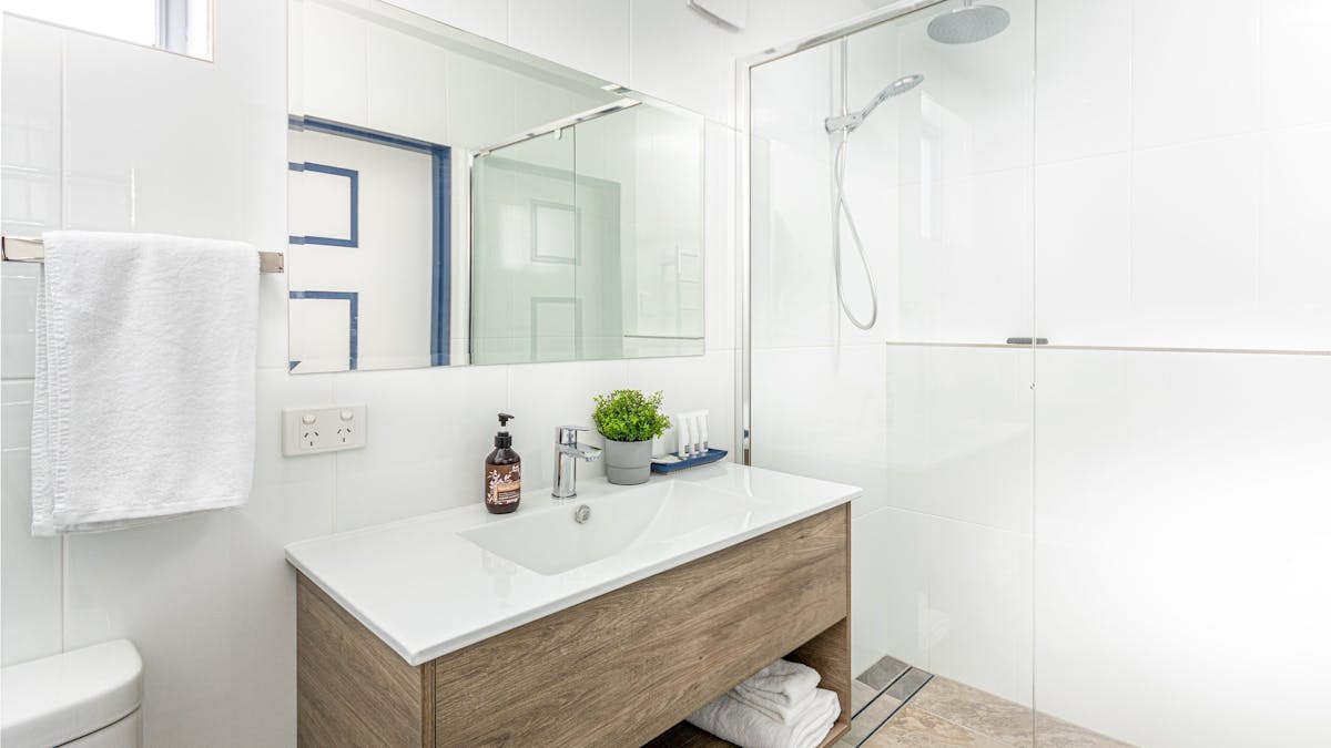 Bathroom area with rain shower head in all units