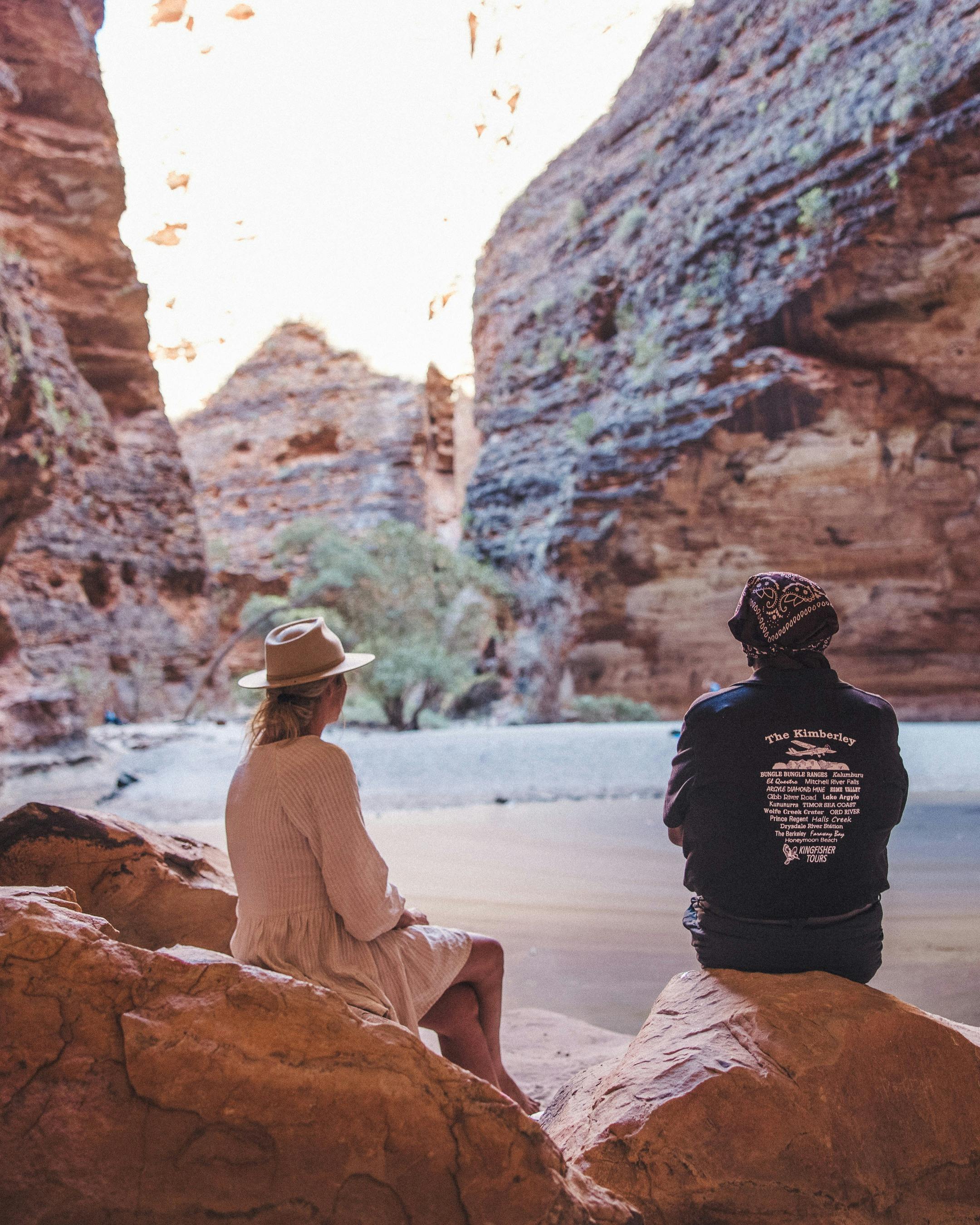Head guide and guest sitting in front of Cathedral Gorge Pool