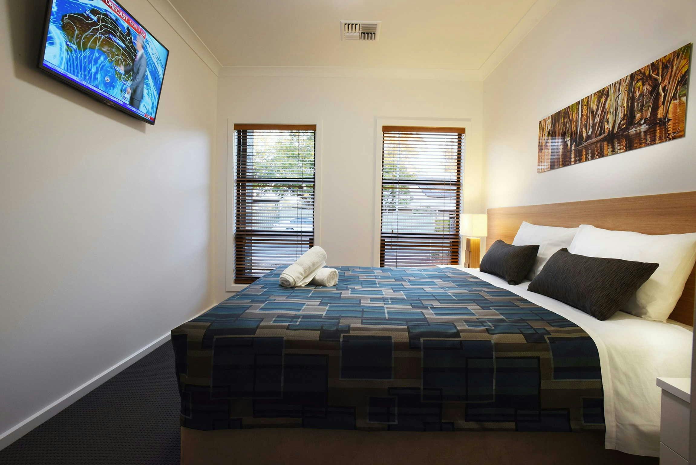 King bedroom (can split into singles) with TV, walk in robe and ensuite