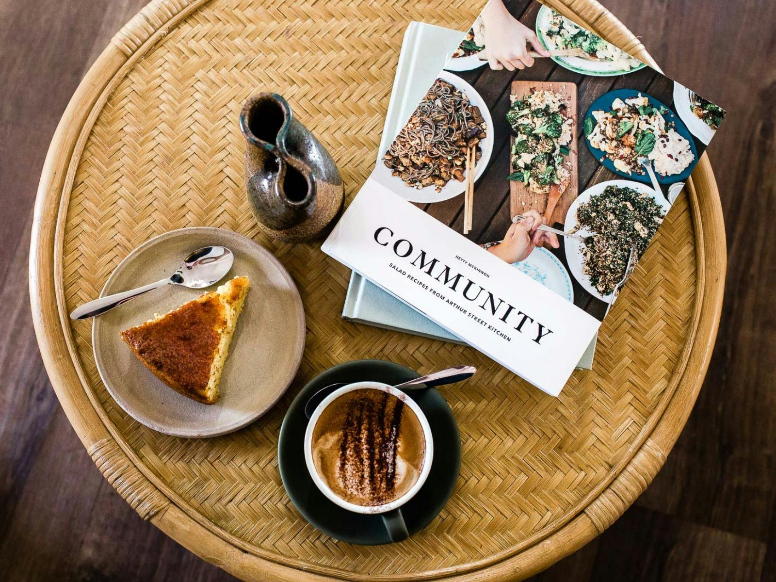 flat lay with coffee, cake and magazines